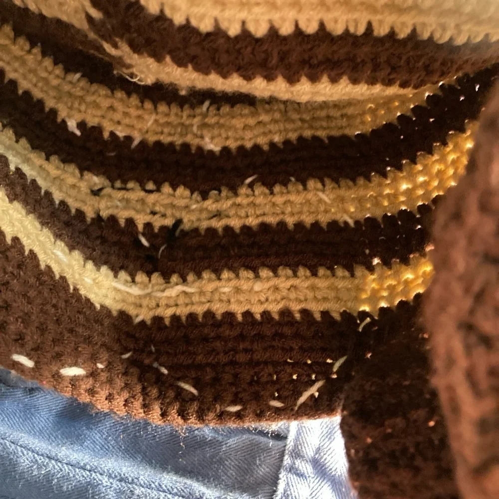 Crochet cat hat with ear flaps      New                 there’s a cat in my lap